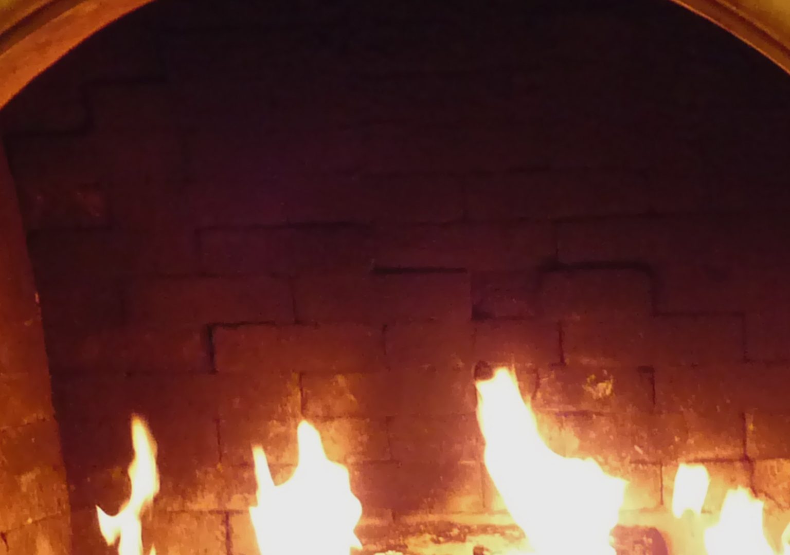 Close-up of fireplace with fire burning